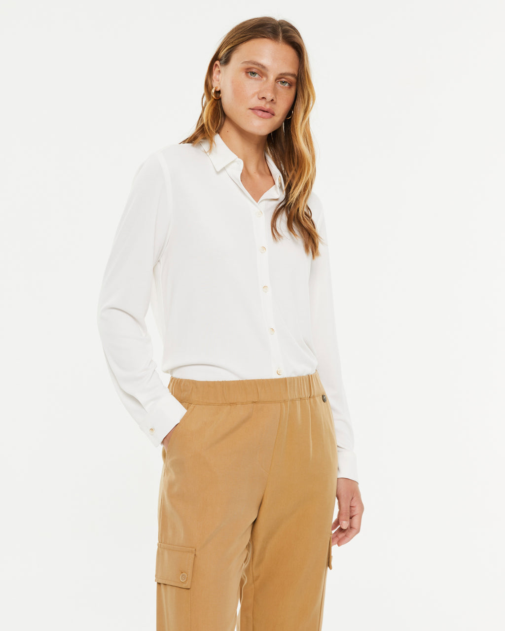 Camisa de mujer en punto liso cuello camisero manga larga