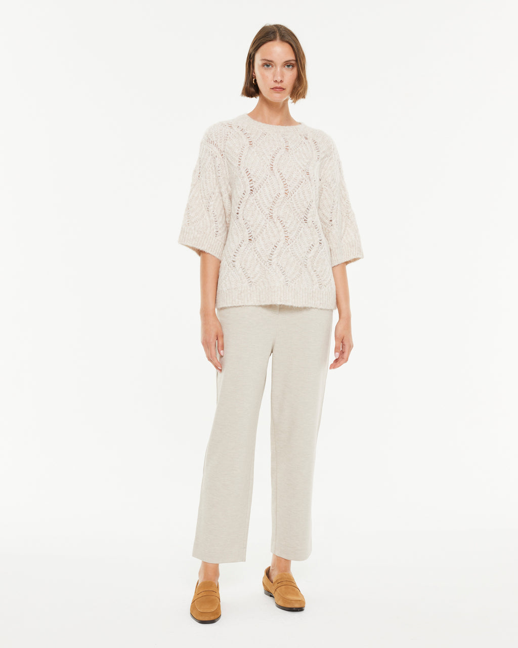 Pull femme en maille fantaisie à col rond et manches jusqu'aux coudes