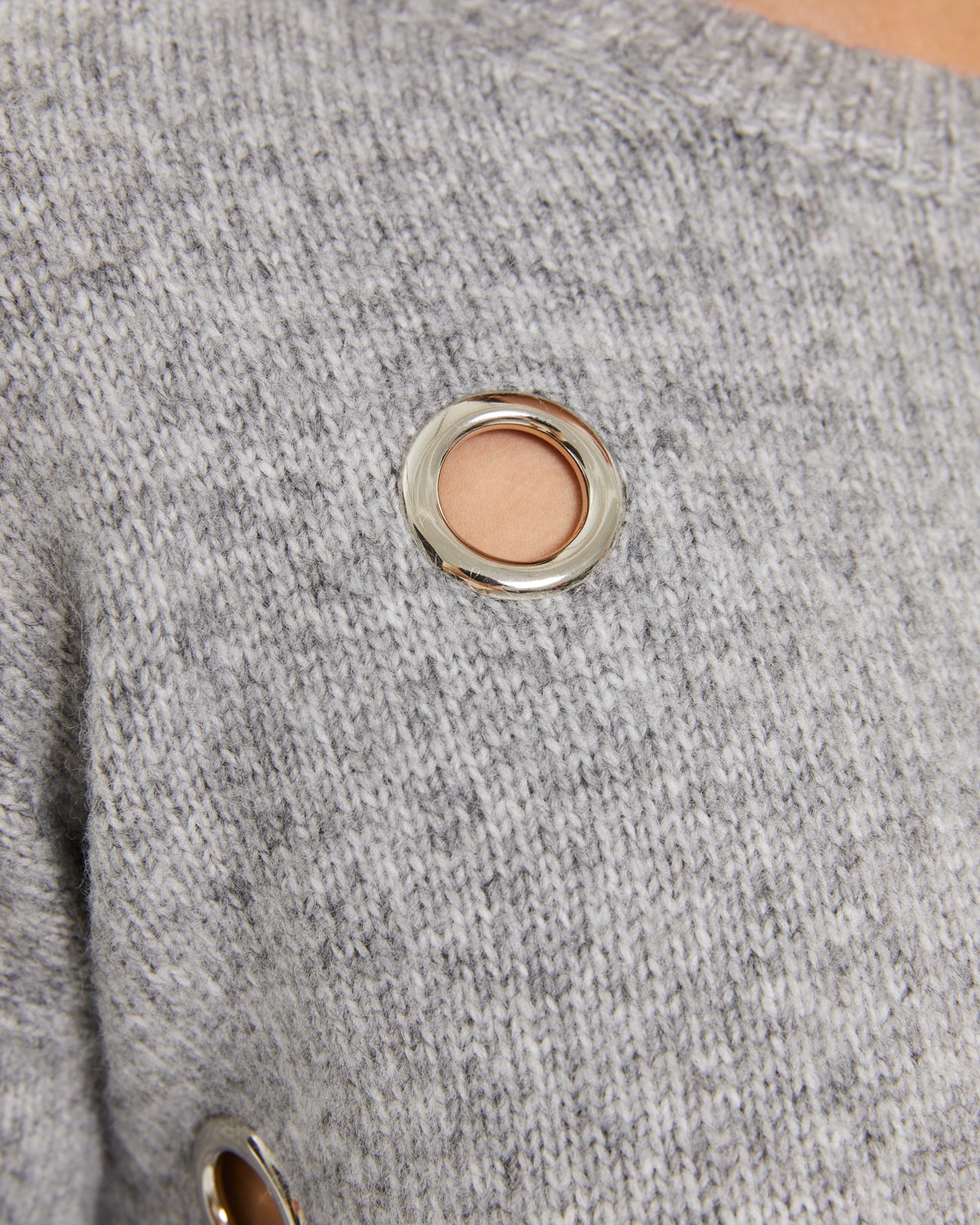 Jersey de mujer fantasía con arandelas metálicas