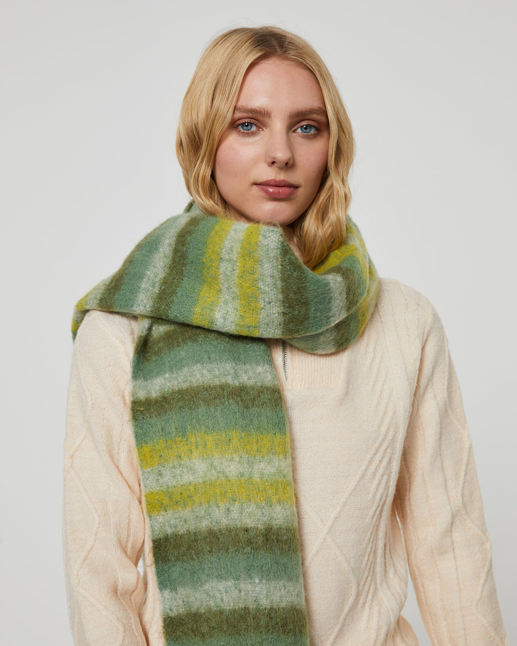 Women's striped scarf in green tones and with long fringes