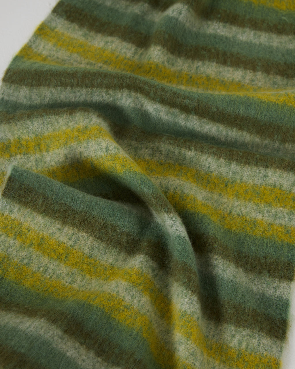 Women's striped scarf in green tones and with long fringes