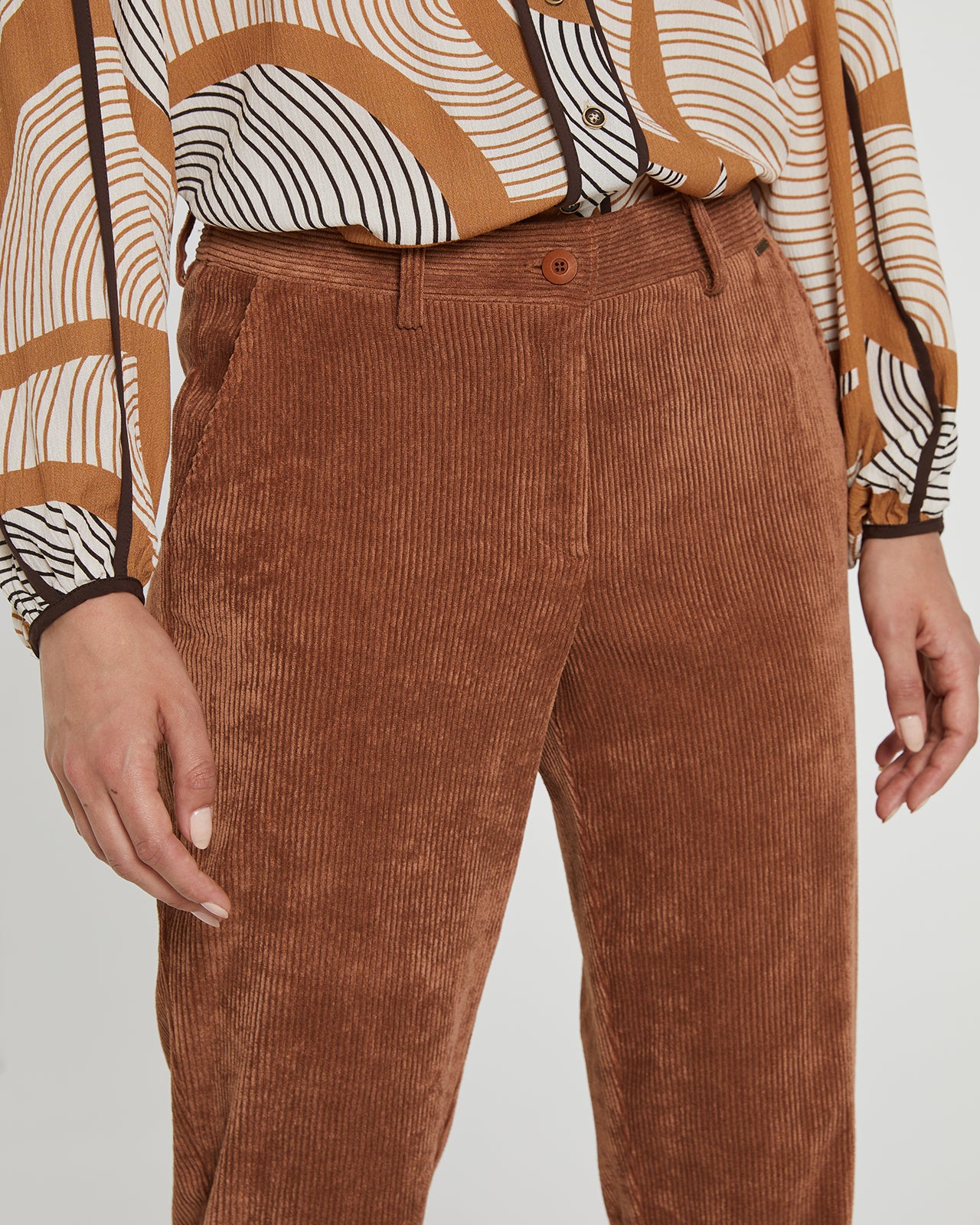 Women's corduroy trousers with a straight cut and cuffs at the bottom