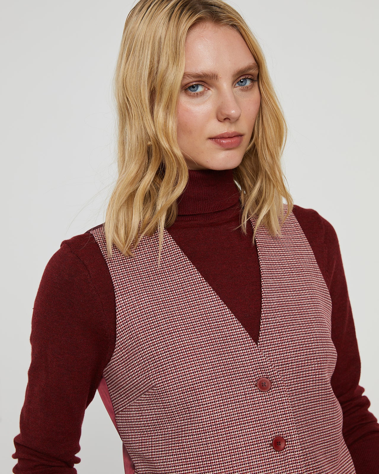 Women's vest with checks on the front and matching stripes on the back