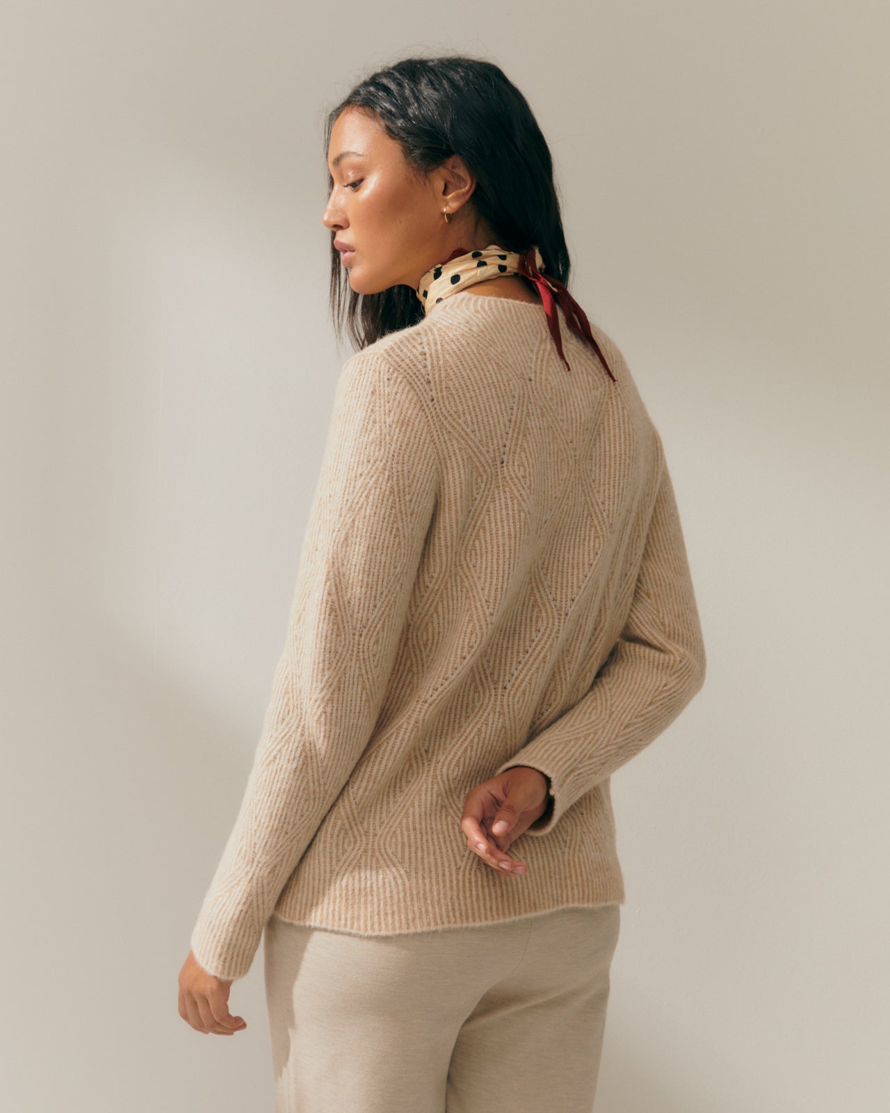 Women's fancy knit sweater with long sleeves and a round neck